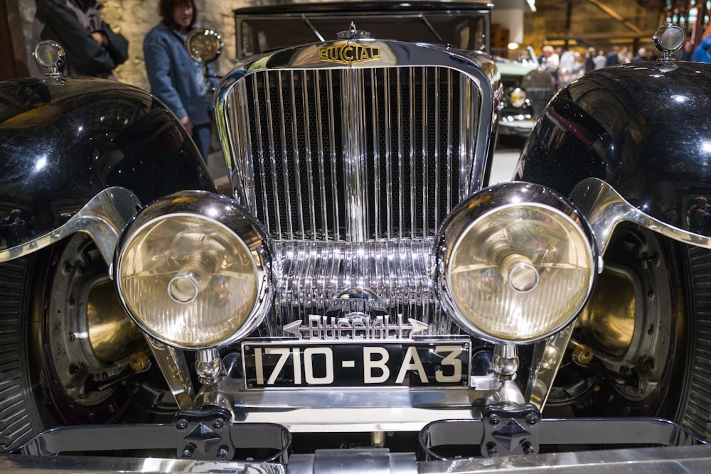 a close up of the front of a classic car