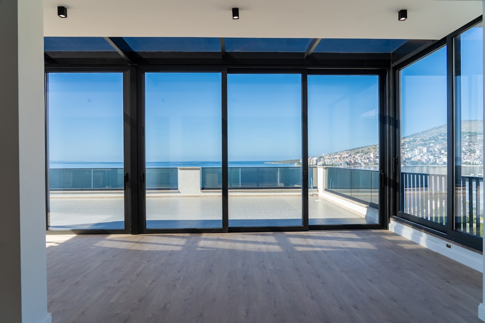 an empty room with a view of the ocean