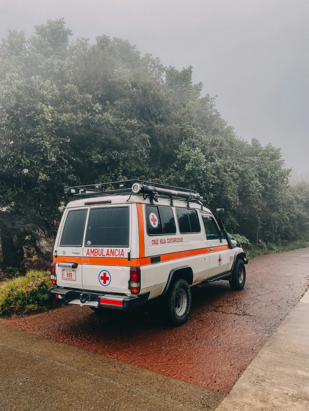 an ambulance parked on the side of the road