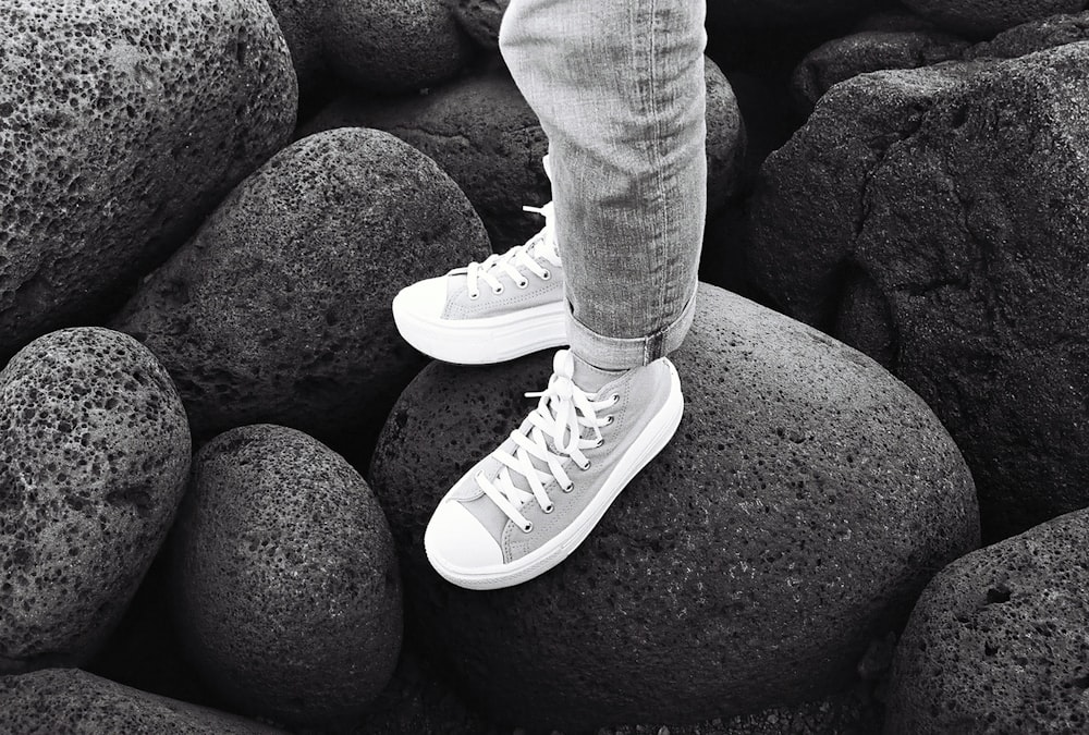 a person standing on top of a pile of rocks