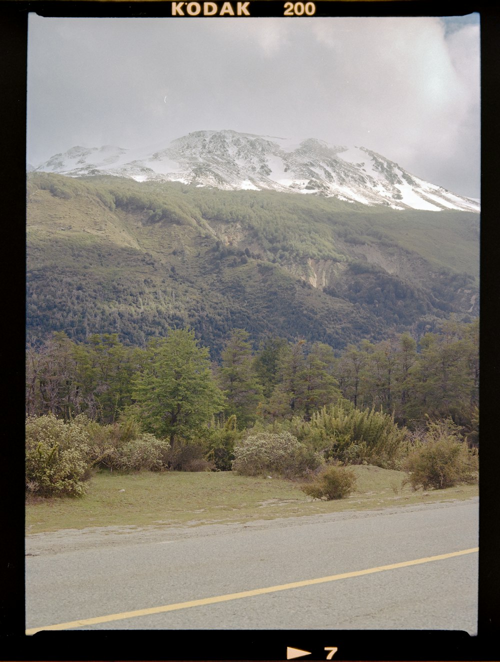 a road with a mountain in the background