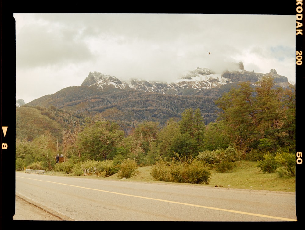 a road with a mountain in the background