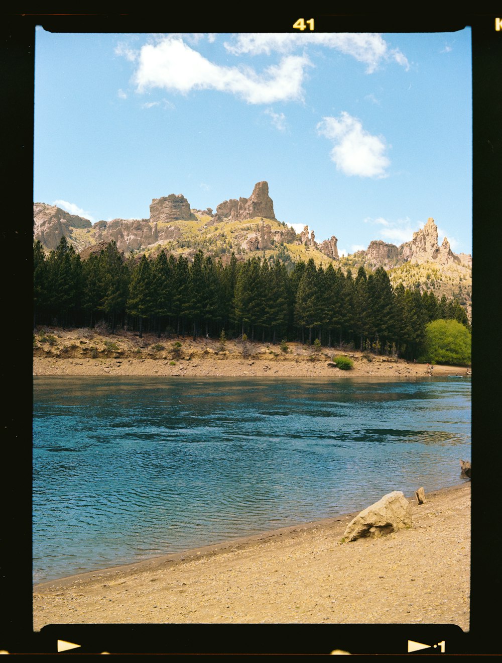 a picture of a lake with a mountain in the background