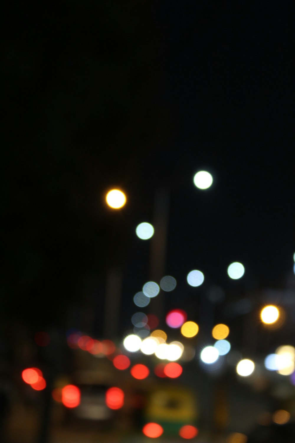 a blurry photo of a city street at night