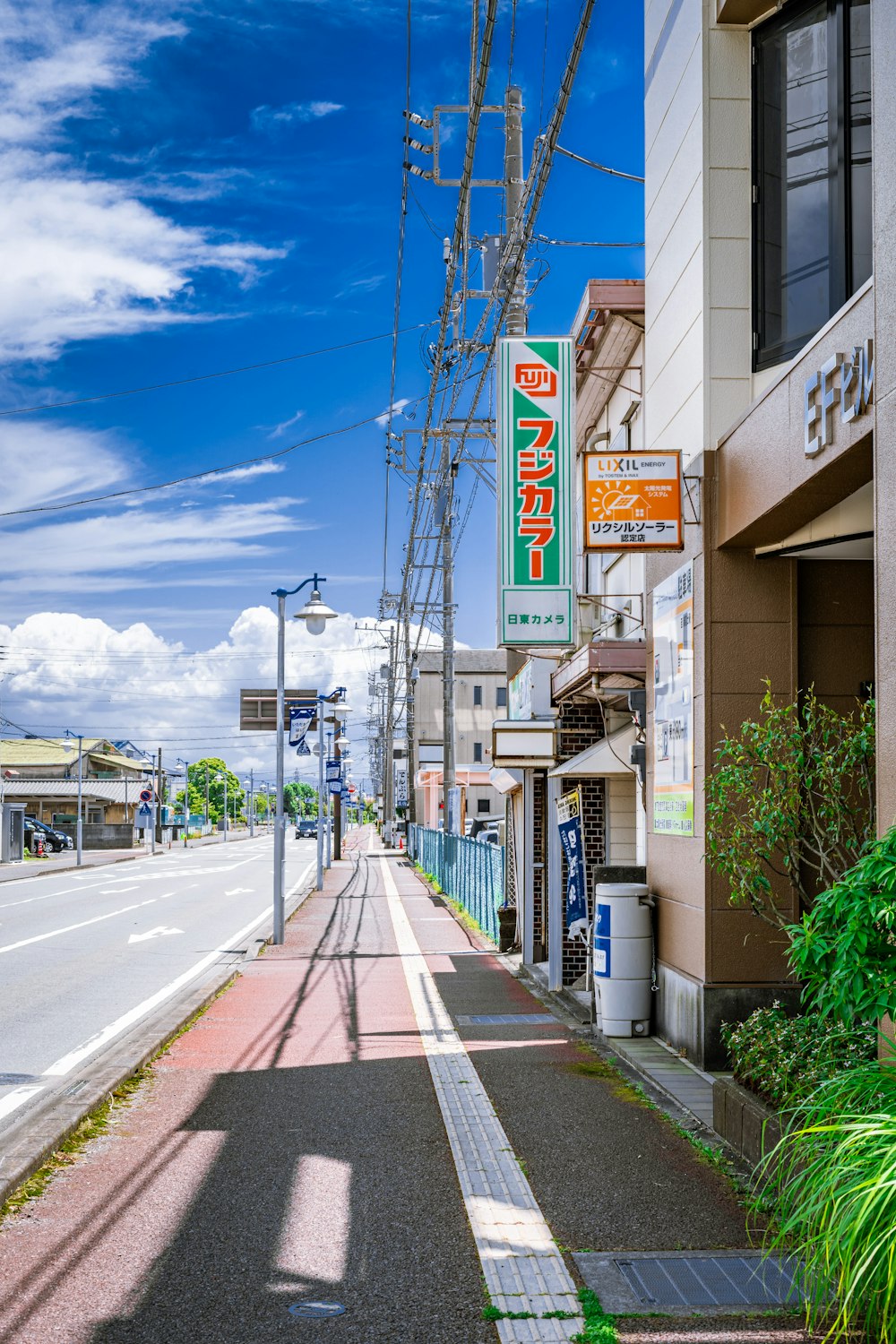 a city street lined with buildings and a street sign