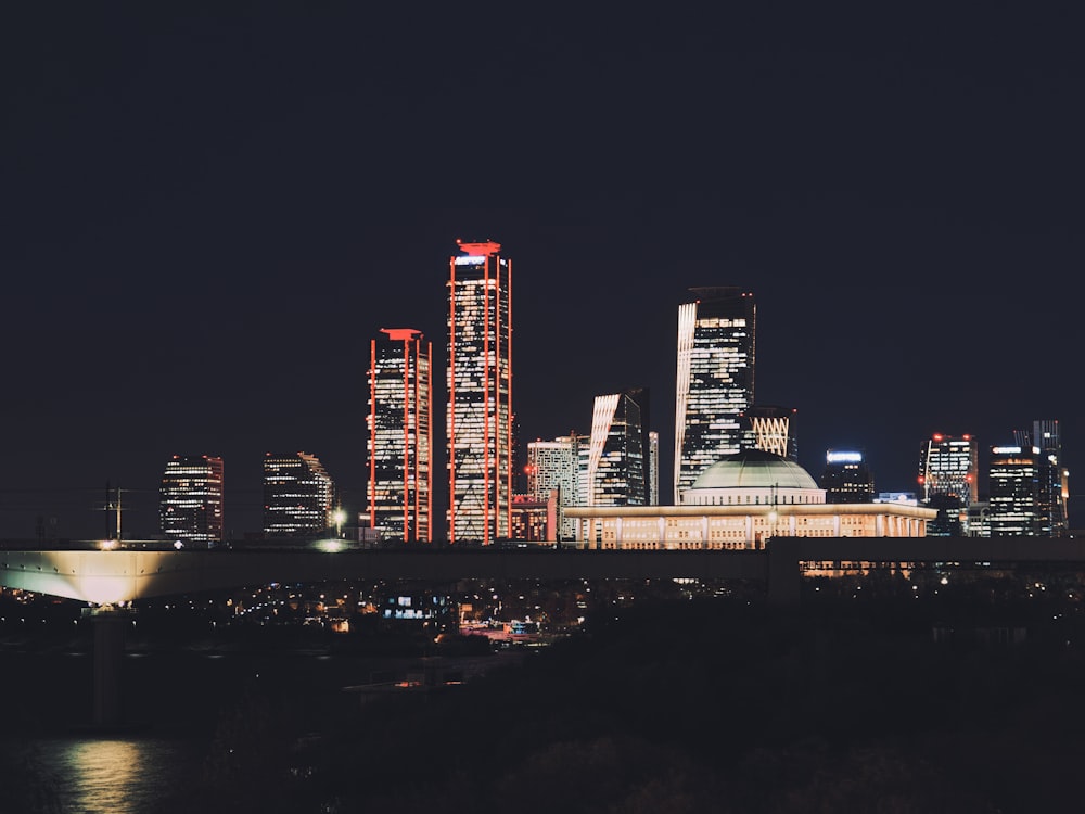 a view of a city at night from across the river