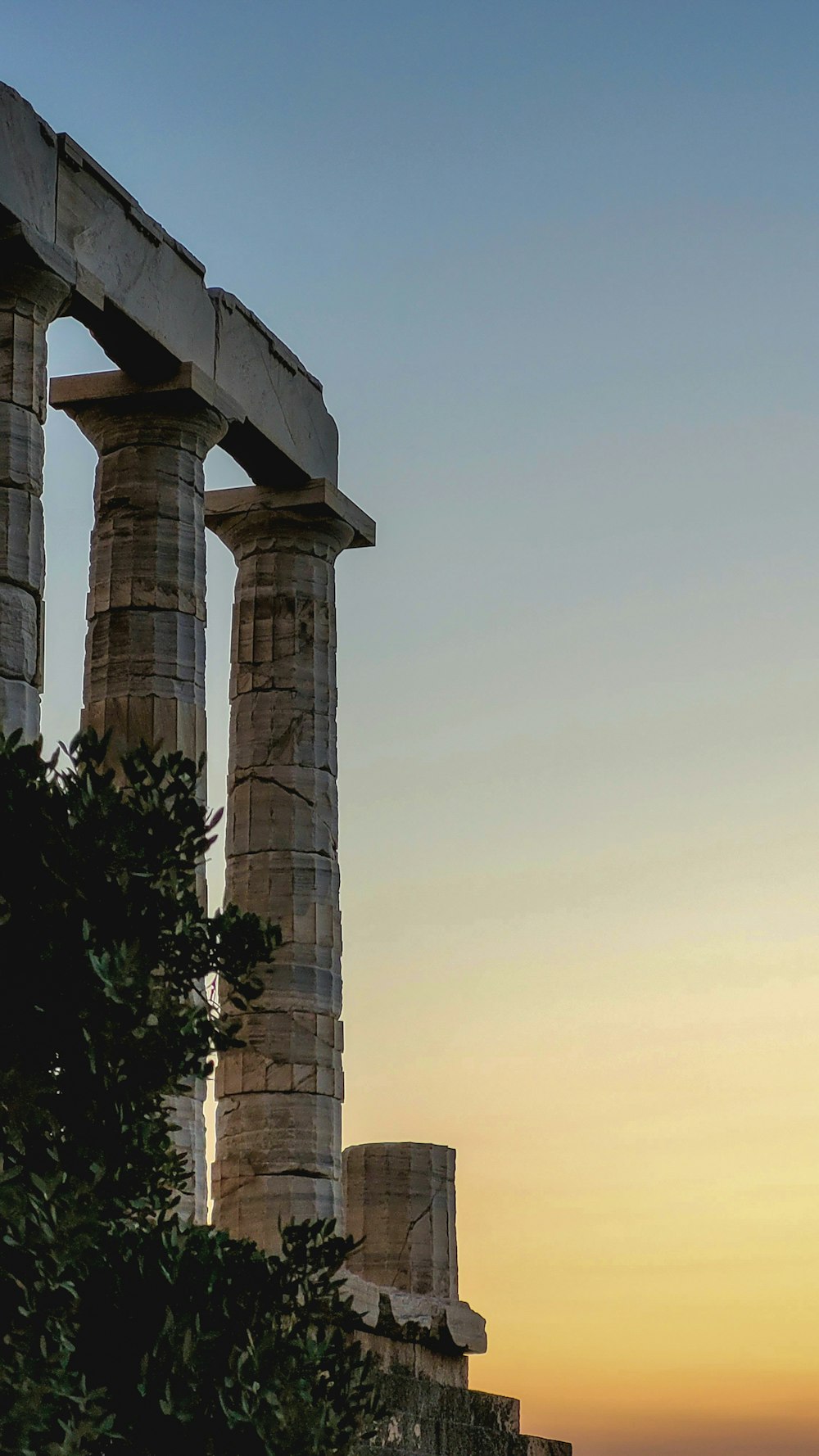 a couple of stone pillars sitting next to each other