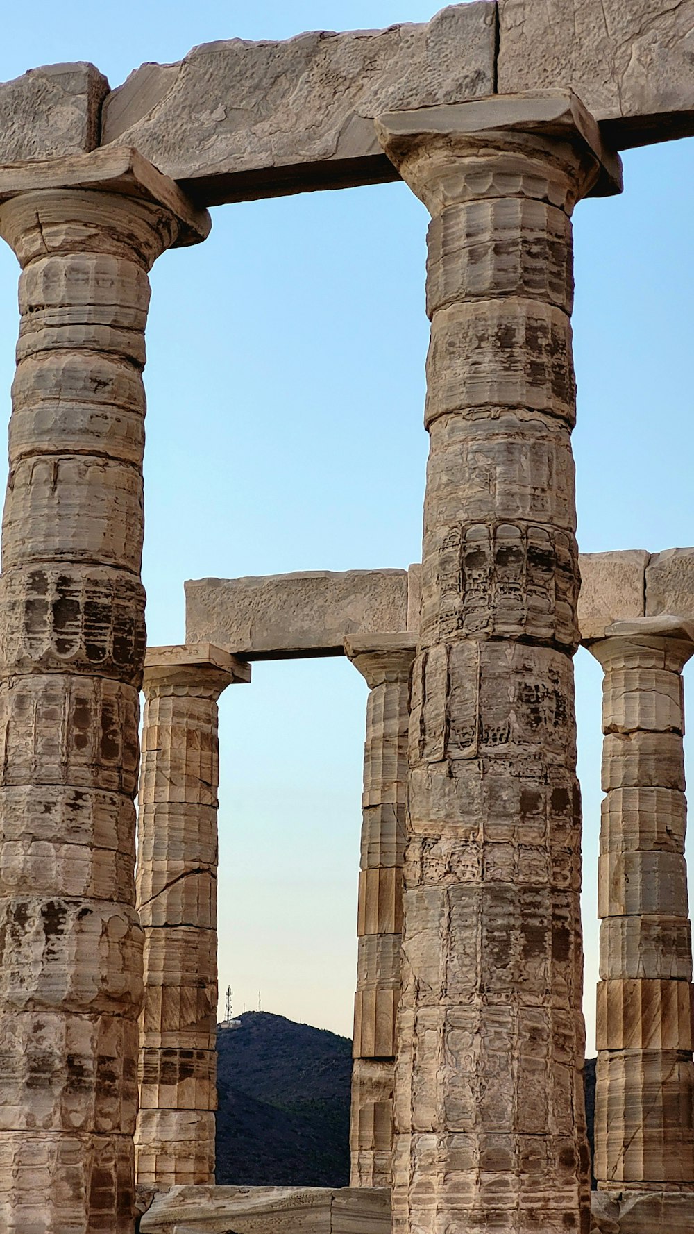 a couple of stone pillars sitting next to each other