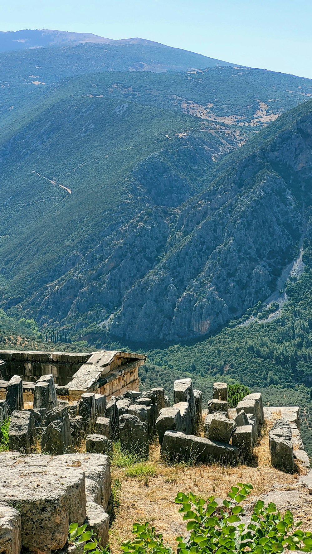 a view of a valley with mountains in the background