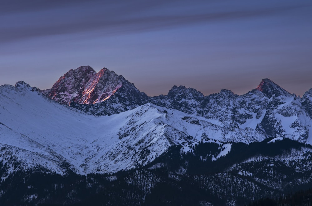 a view of a mountain range at dusk