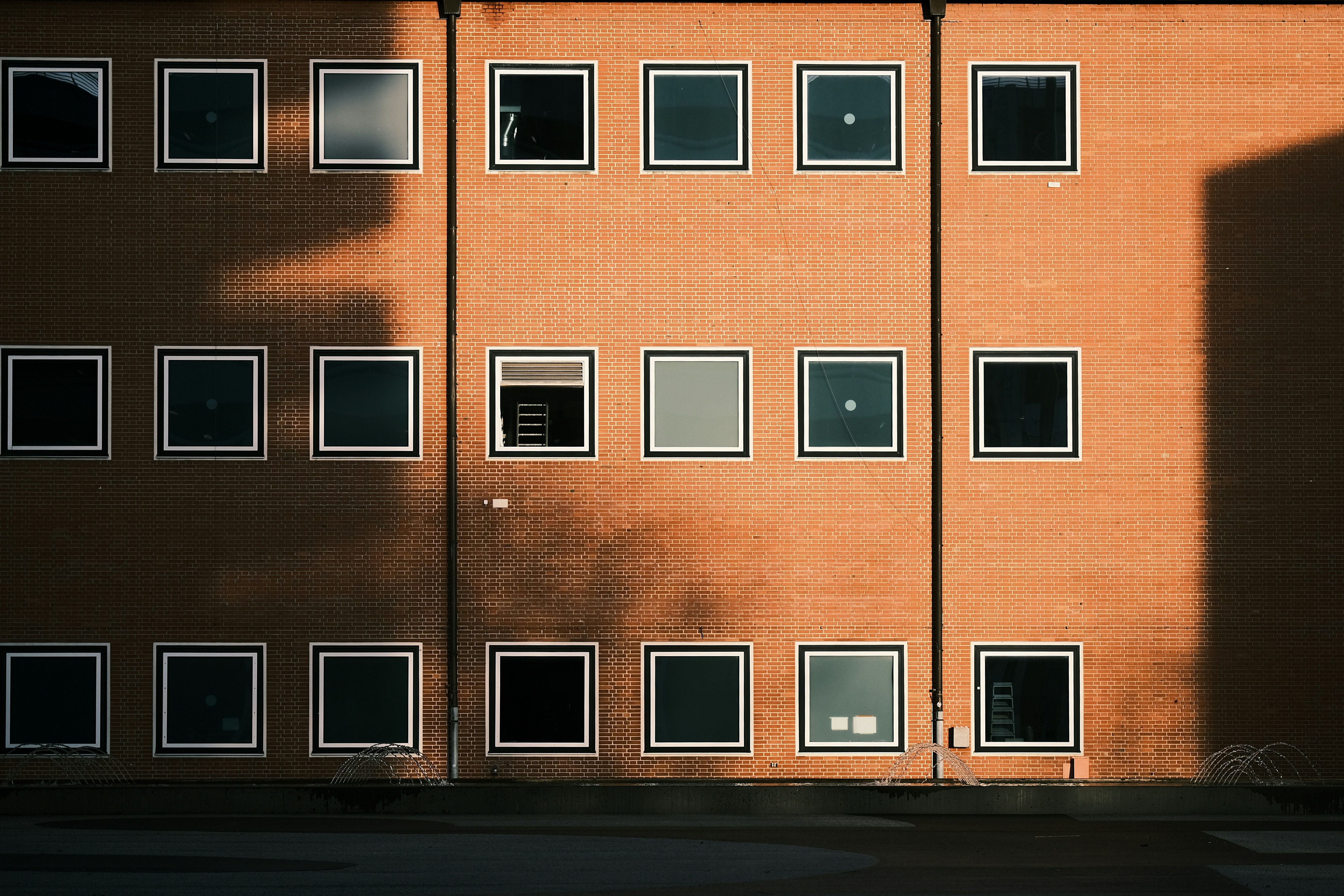 A tall brick building with lots of windows photo – Free Basel Image on ...