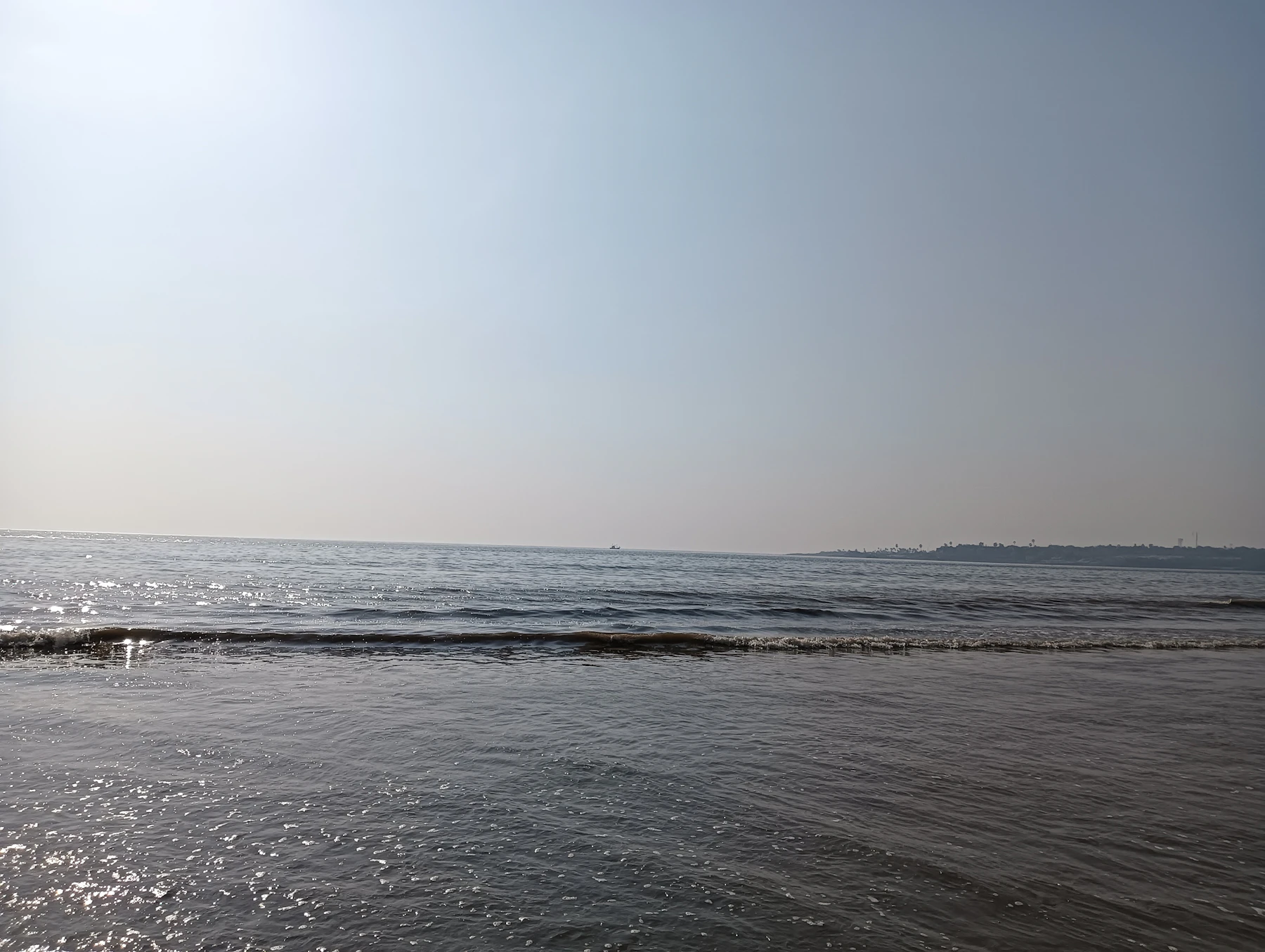 Versova's water under a blue sky