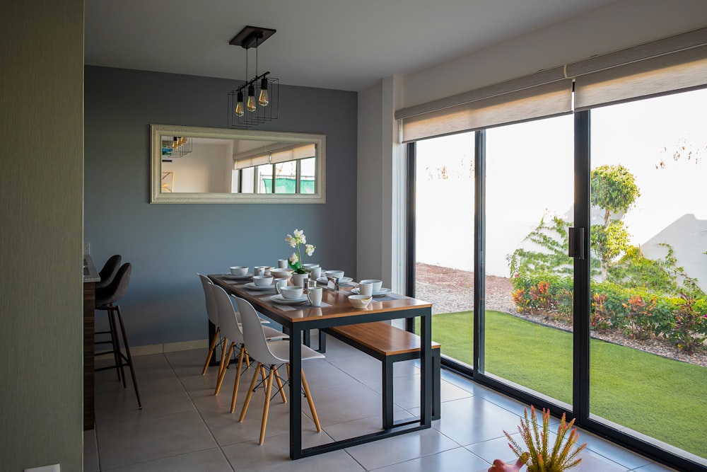 a dining room with a table and chairs