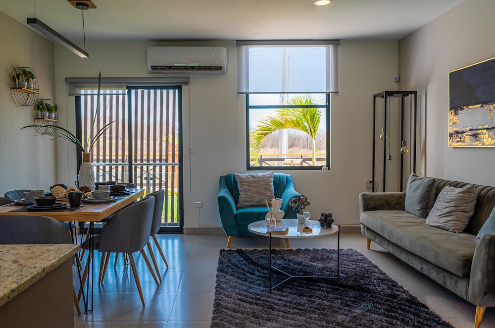 a living room filled with furniture and a table