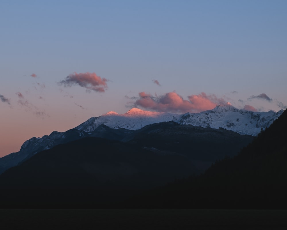 a view of a mountain range at sunset