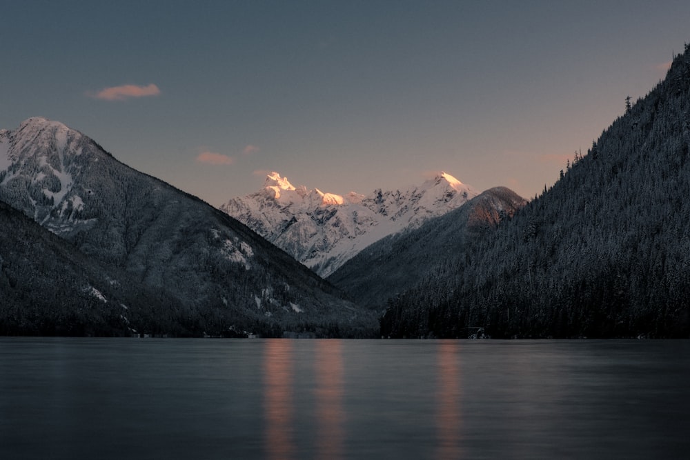 a mountain range with a body of water in front of it