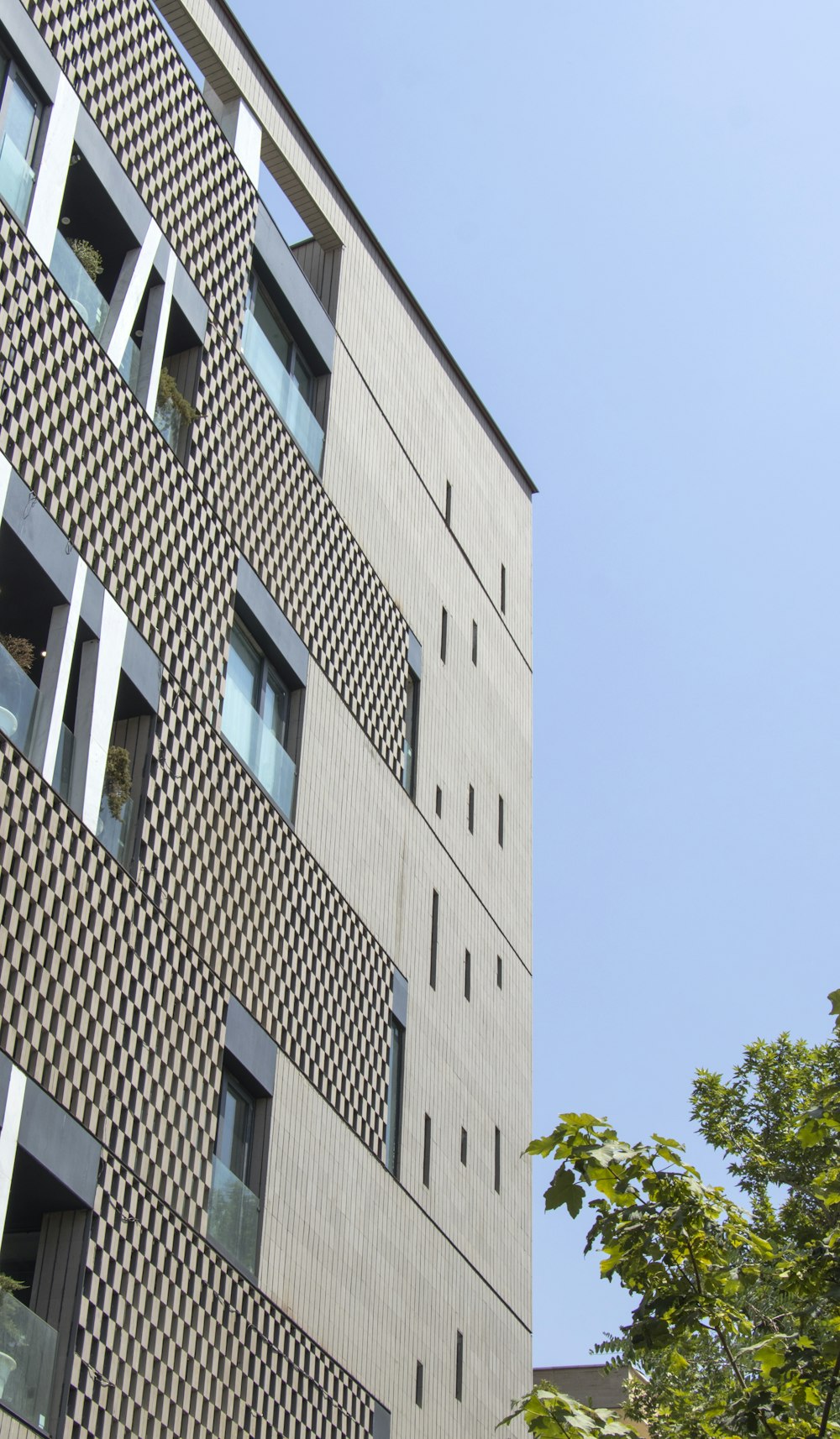 a tall building with a clock on the side of it