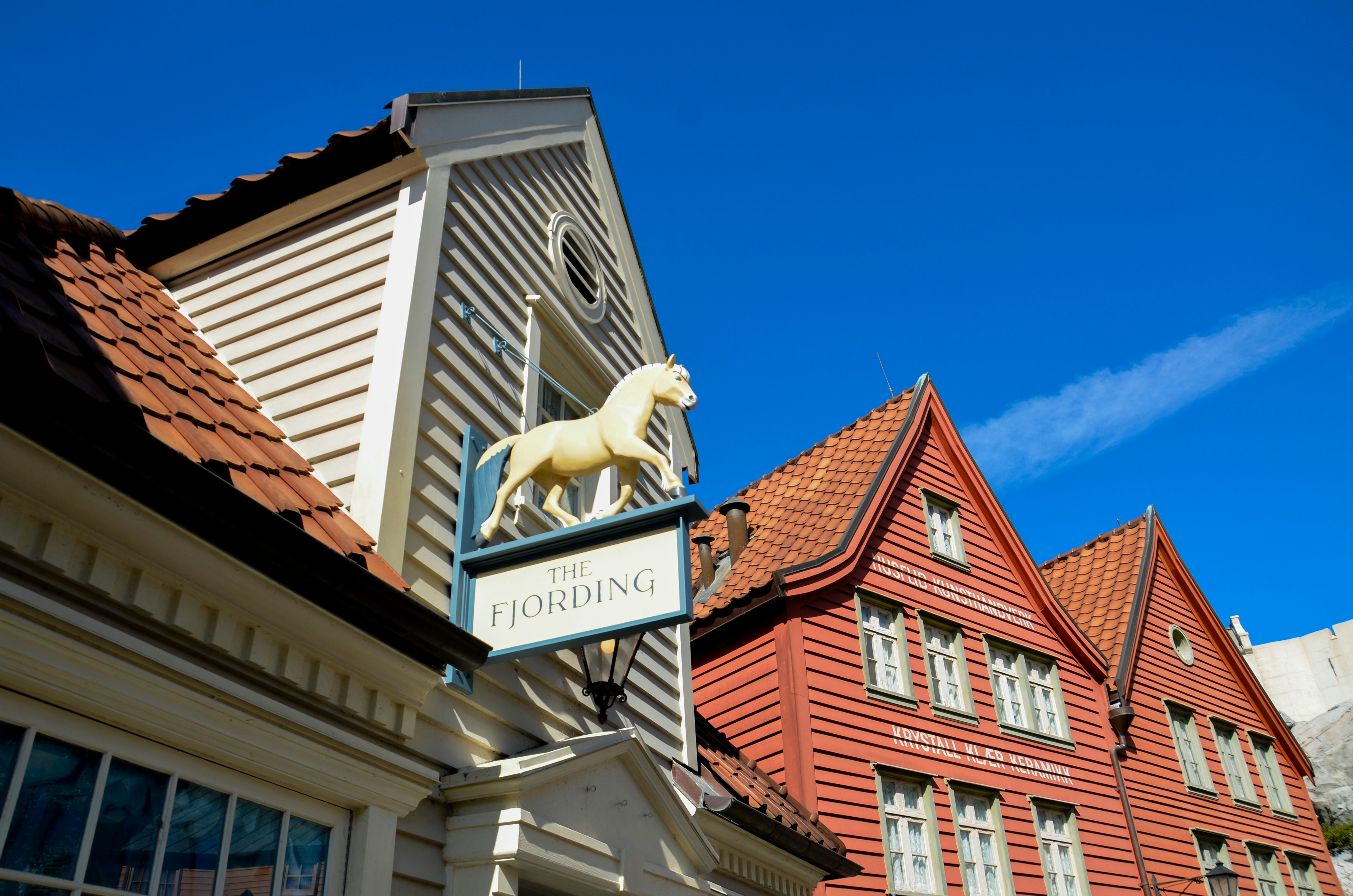 a white horse on a sign on a building