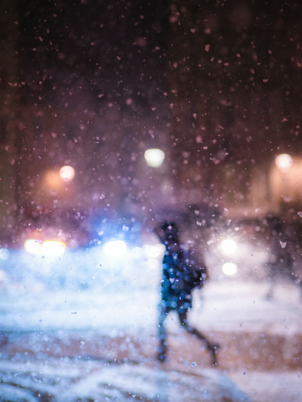 a blurry photo of a person walking in the snow
