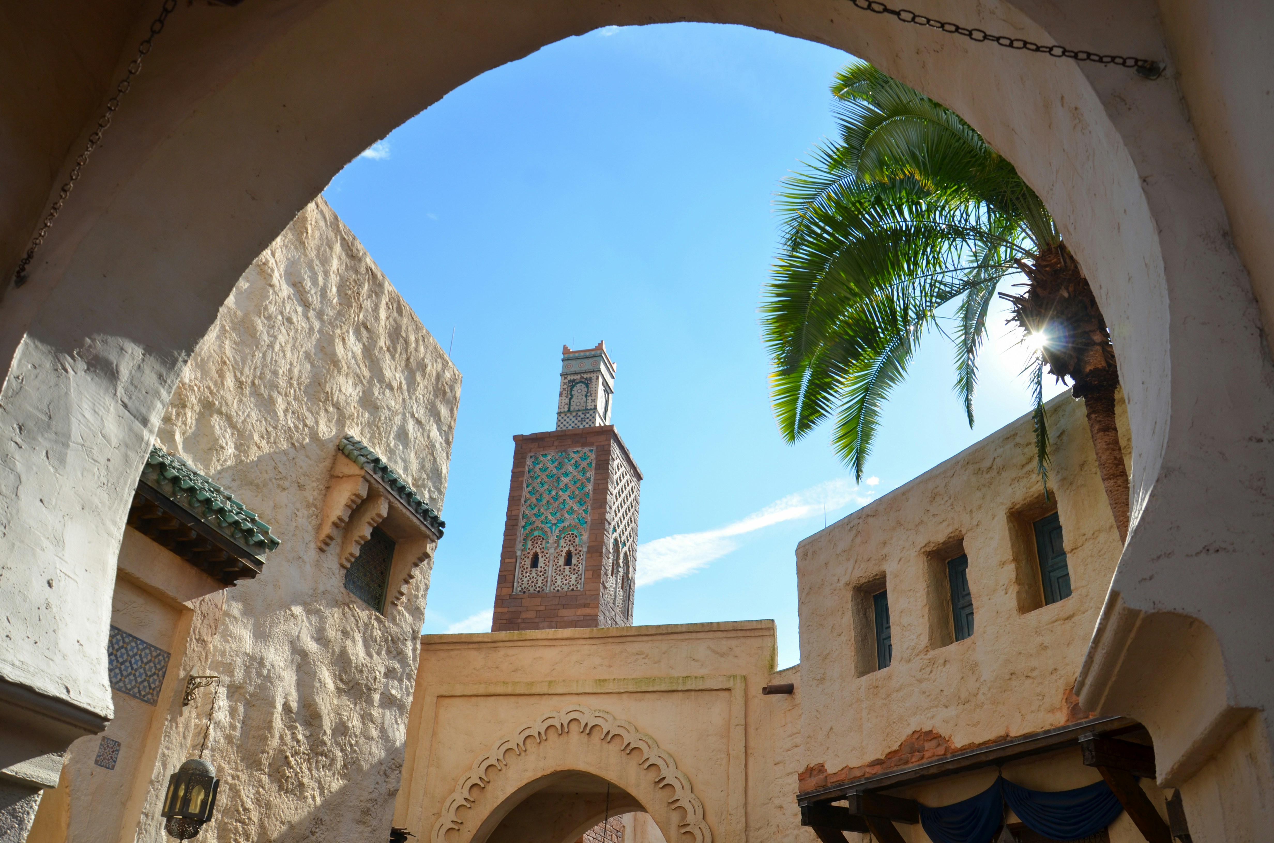 A view of a clock tower through an archway