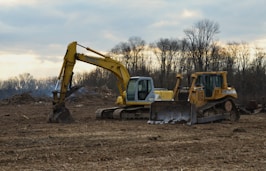 a bulldozer and a bulldozer in a field