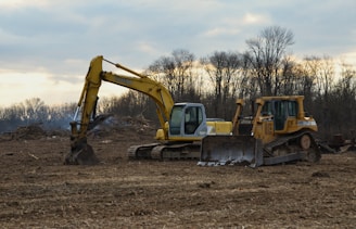 a bulldozer and a bulldozer in a field