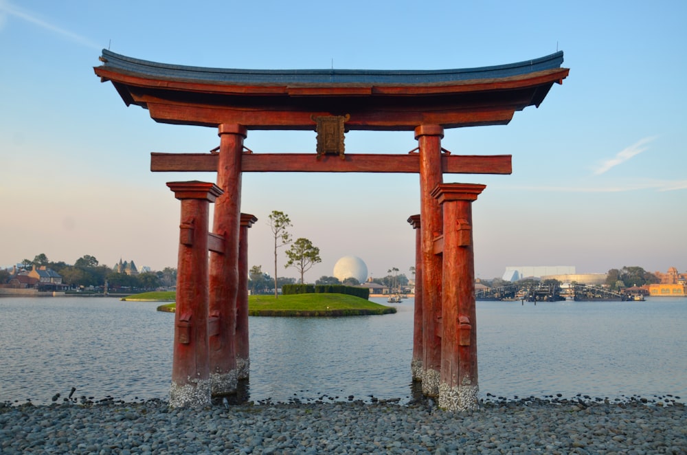 a large body of water next to a wooden structure