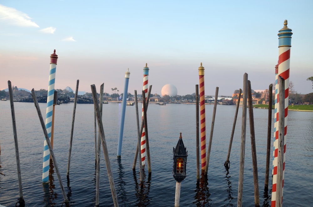 a bunch of poles sticking out of the water