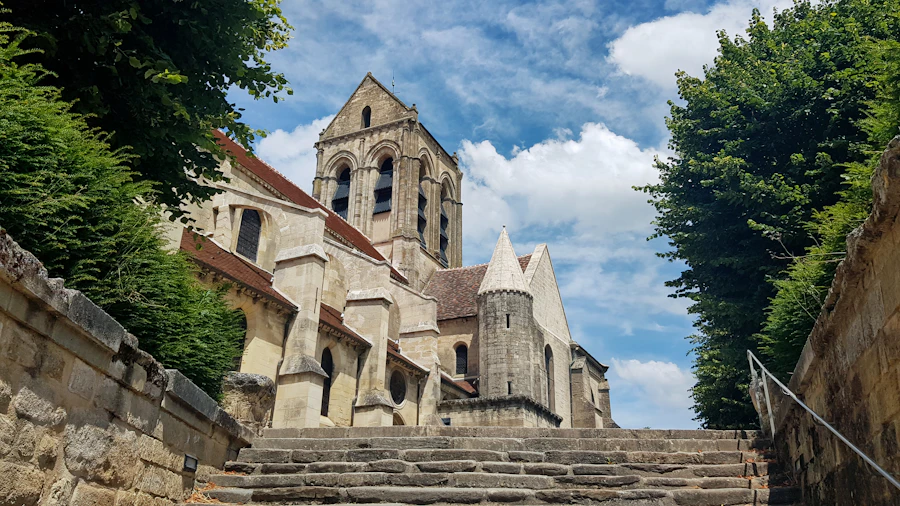 An old stone church with a steeple and worn stone steps