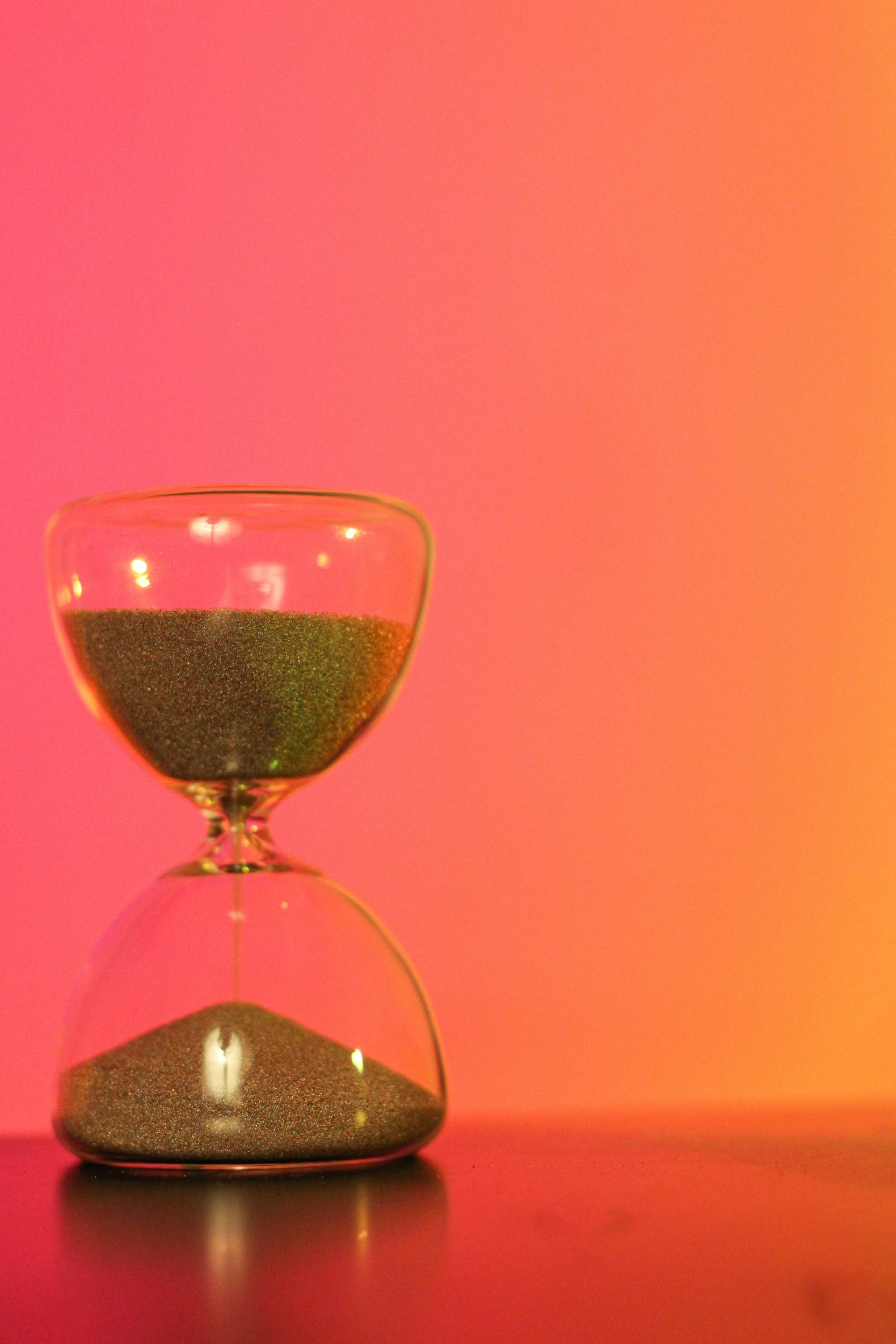 an hourglass sitting on top of a table