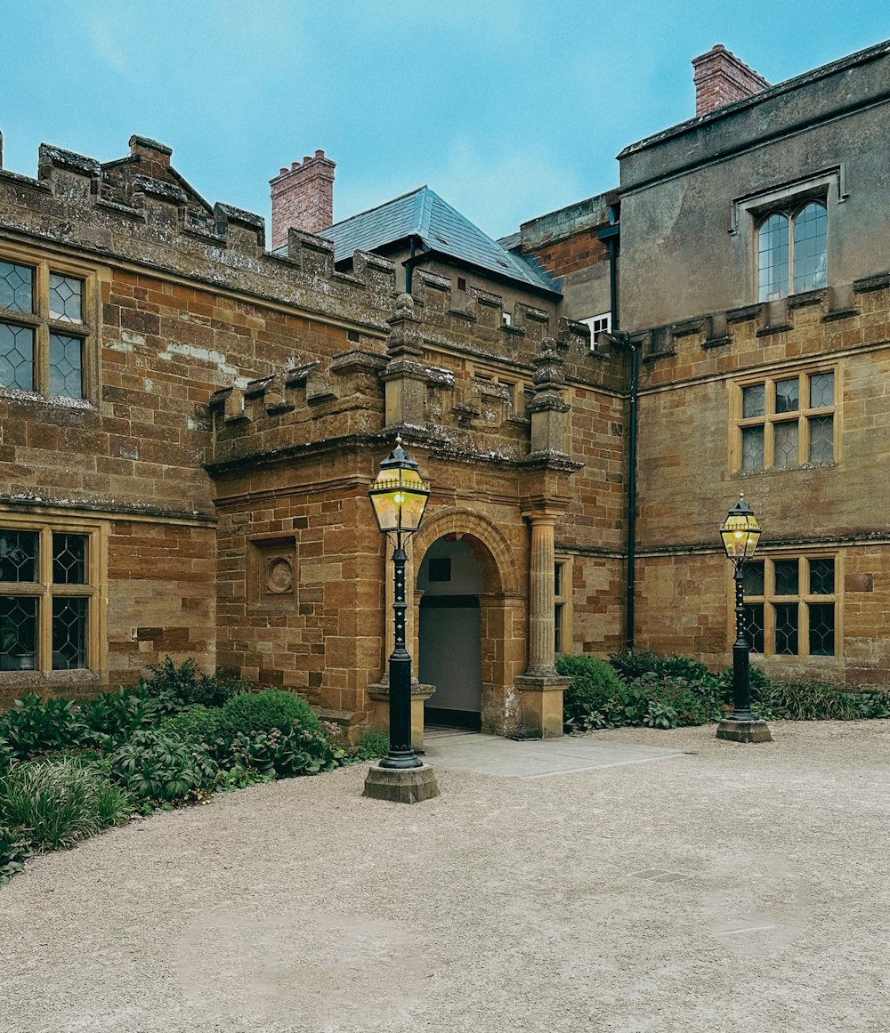 an old building with a lamp post in front of it