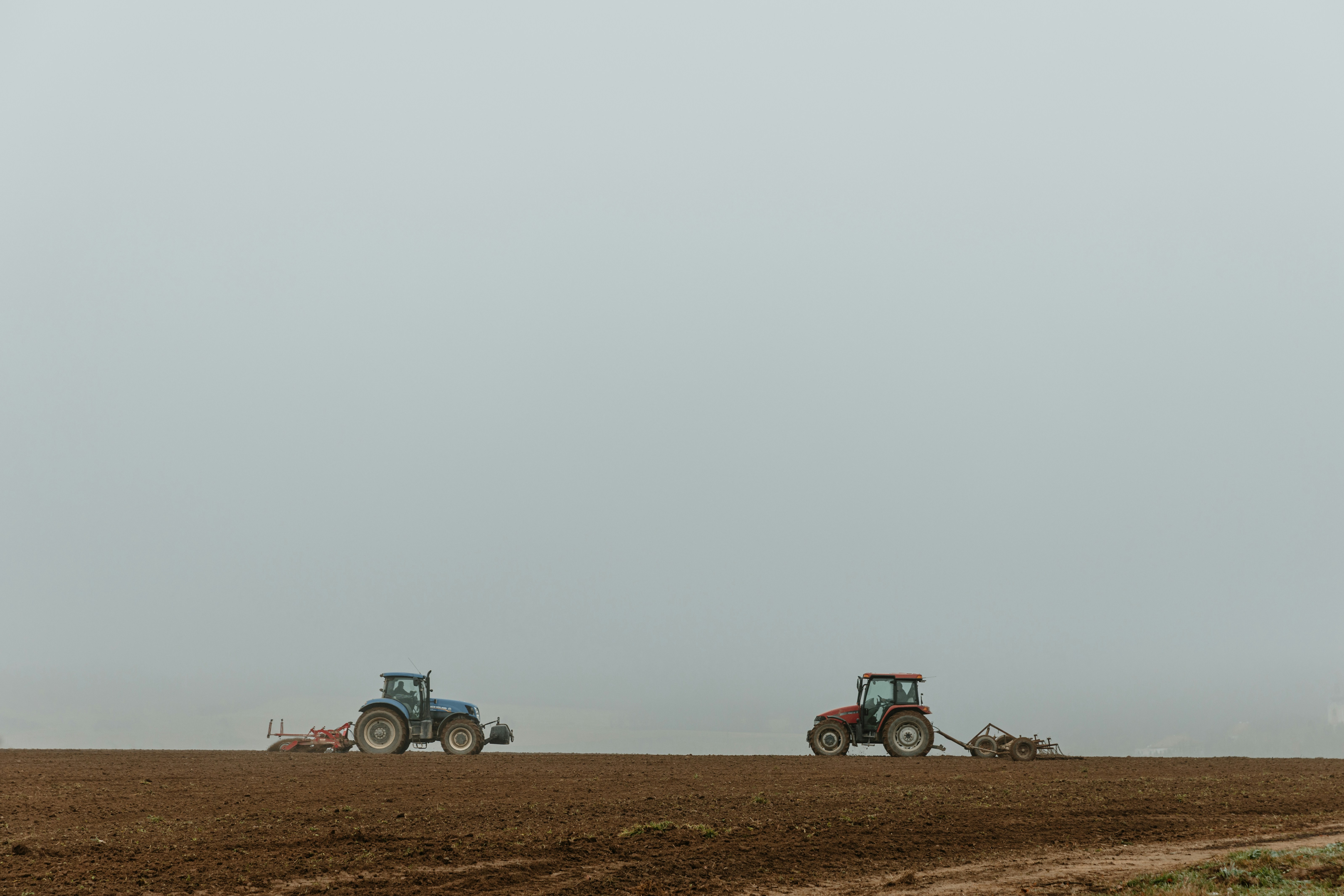 Two tractors going toward each other