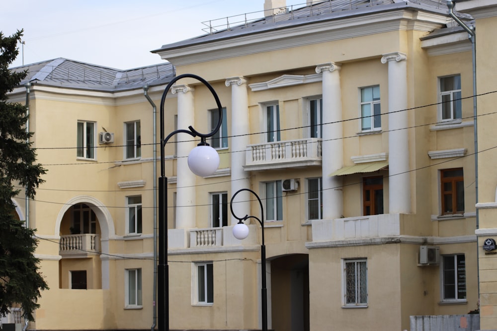 a street light in front of a large building