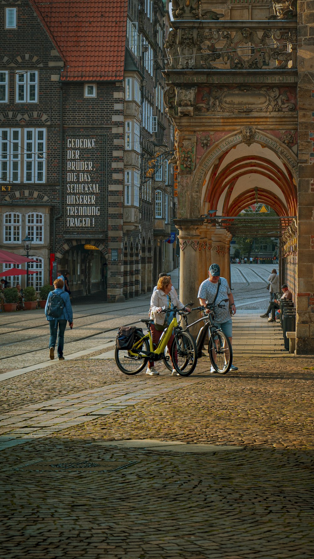 a group of people standing around with bikes