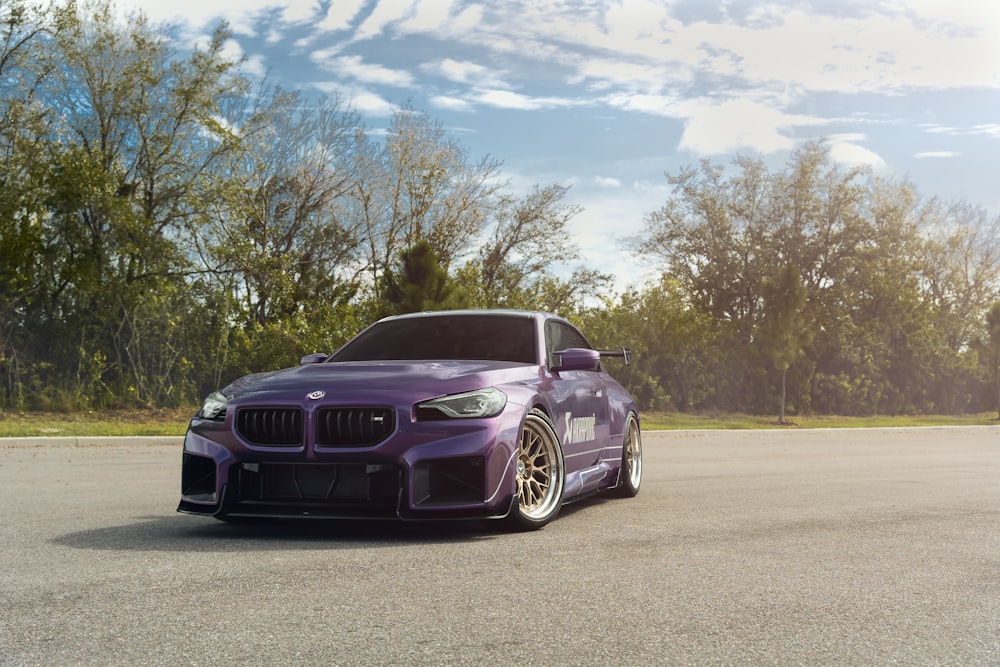 a purple car parked on the side of the road