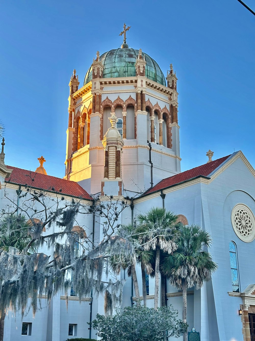 a large white building with a clock tower