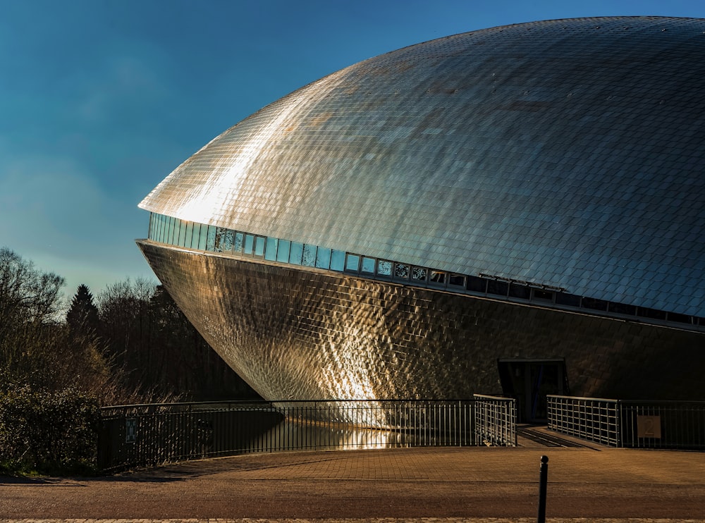 a large building with a large metal structure on top of it