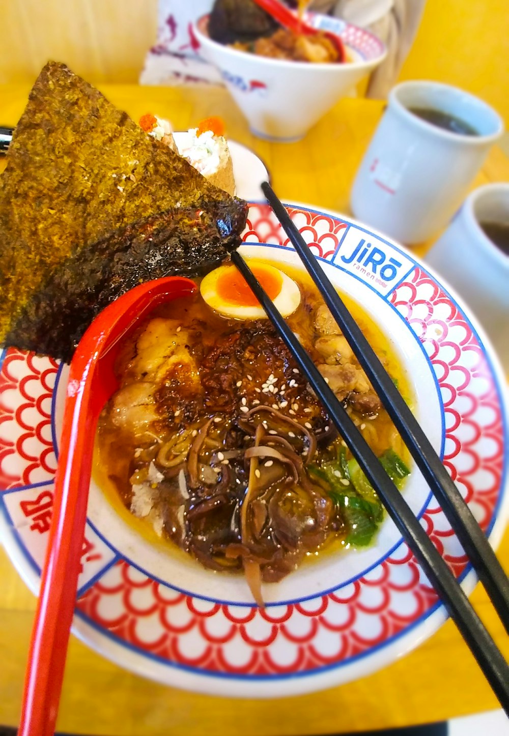 a plate of food with chopsticks on a table