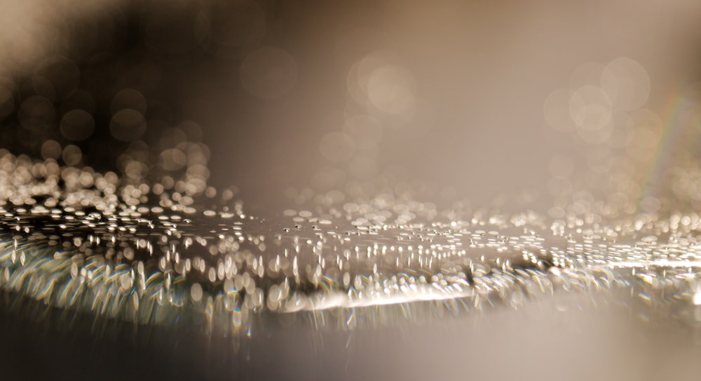 a close up of water droplets on a surface