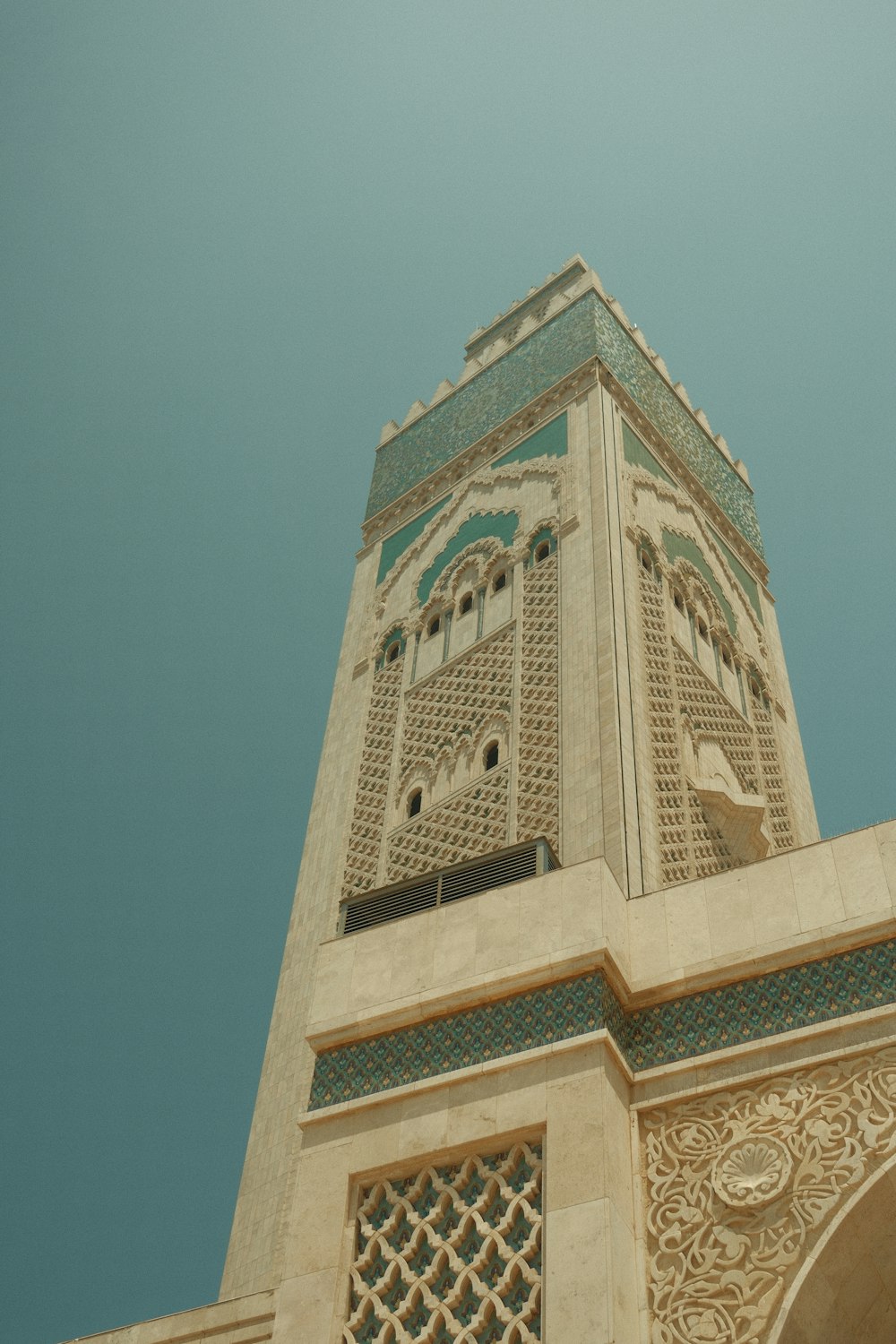 a tall tower with a clock on the top of it