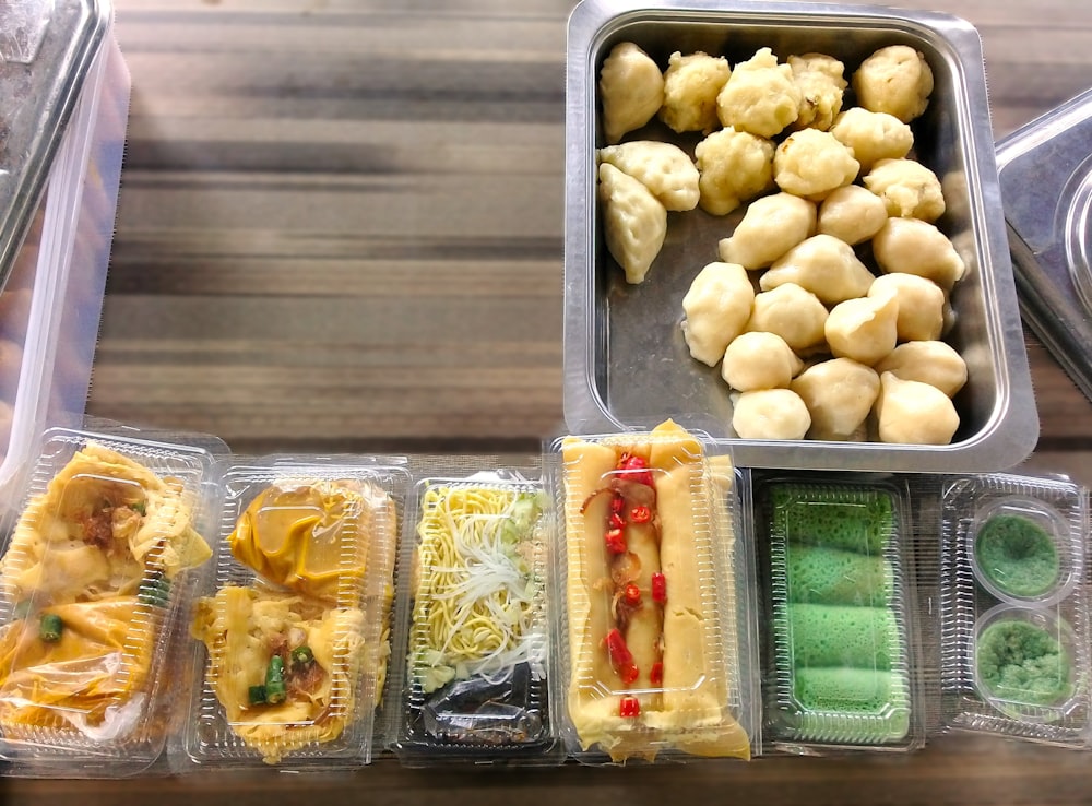a variety of food in plastic containers on a table