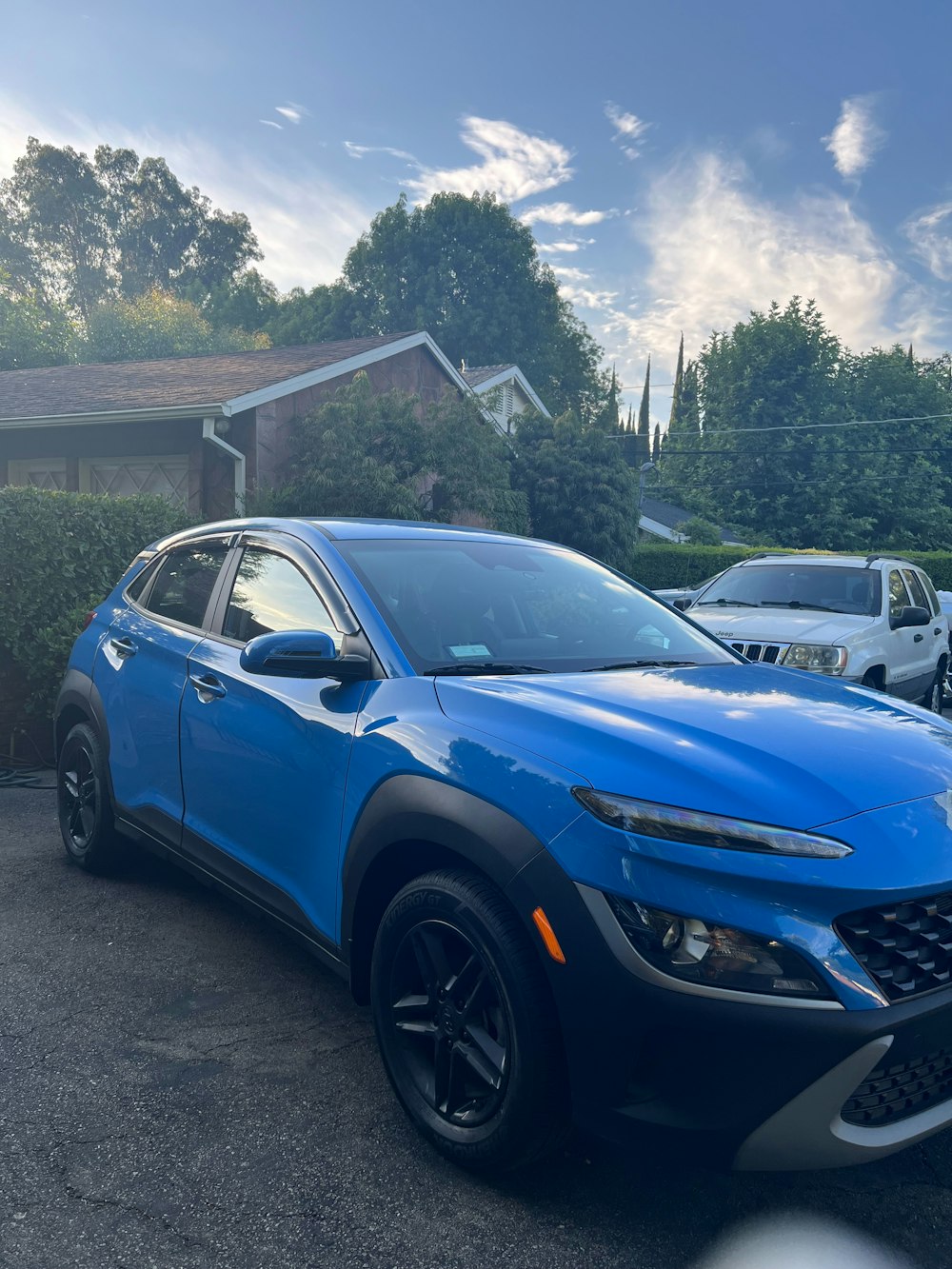 a blue car parked in a parking lot