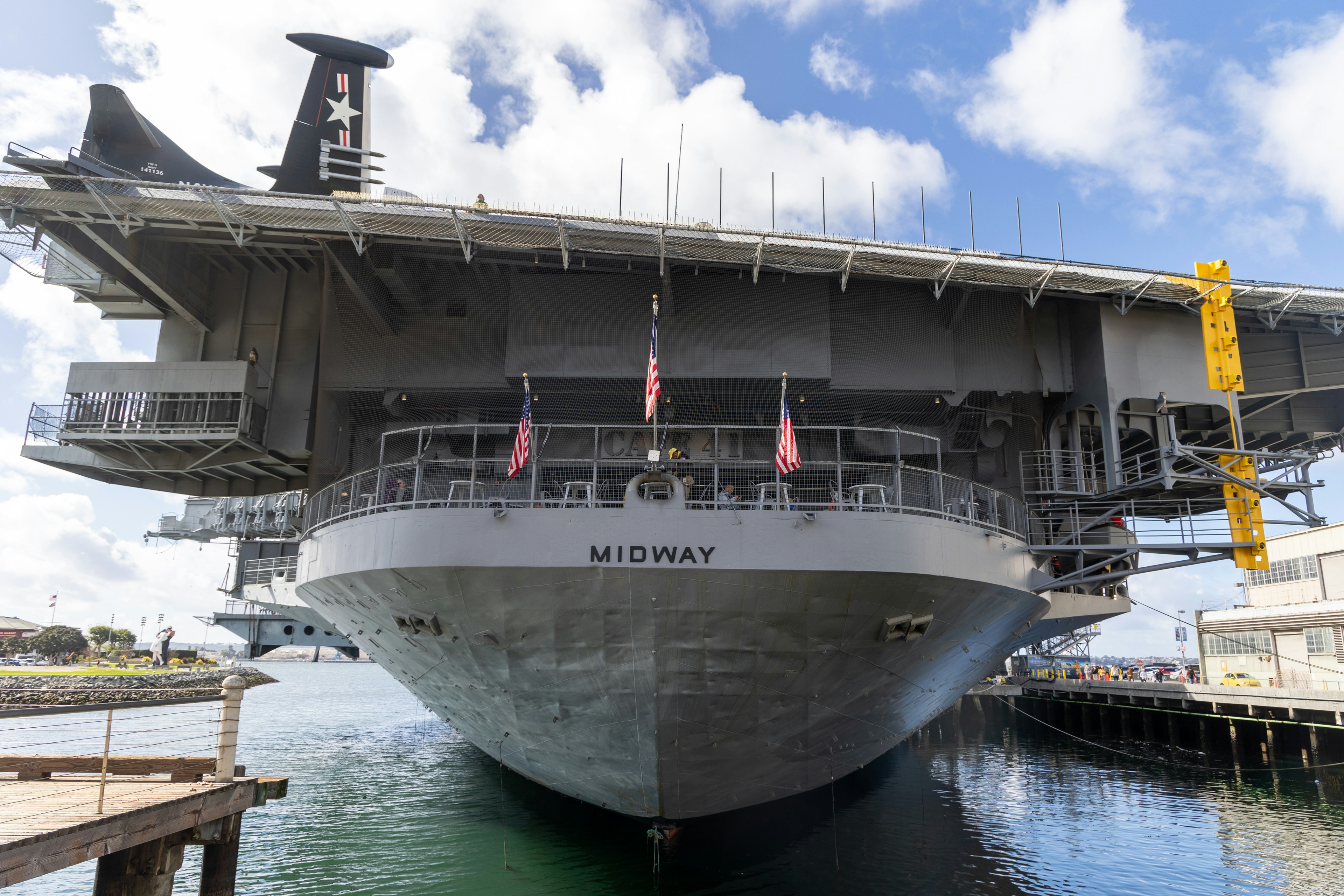 a large boat is docked at a dock, USS Midway Aircraft Carrier | San Diego Museum, California