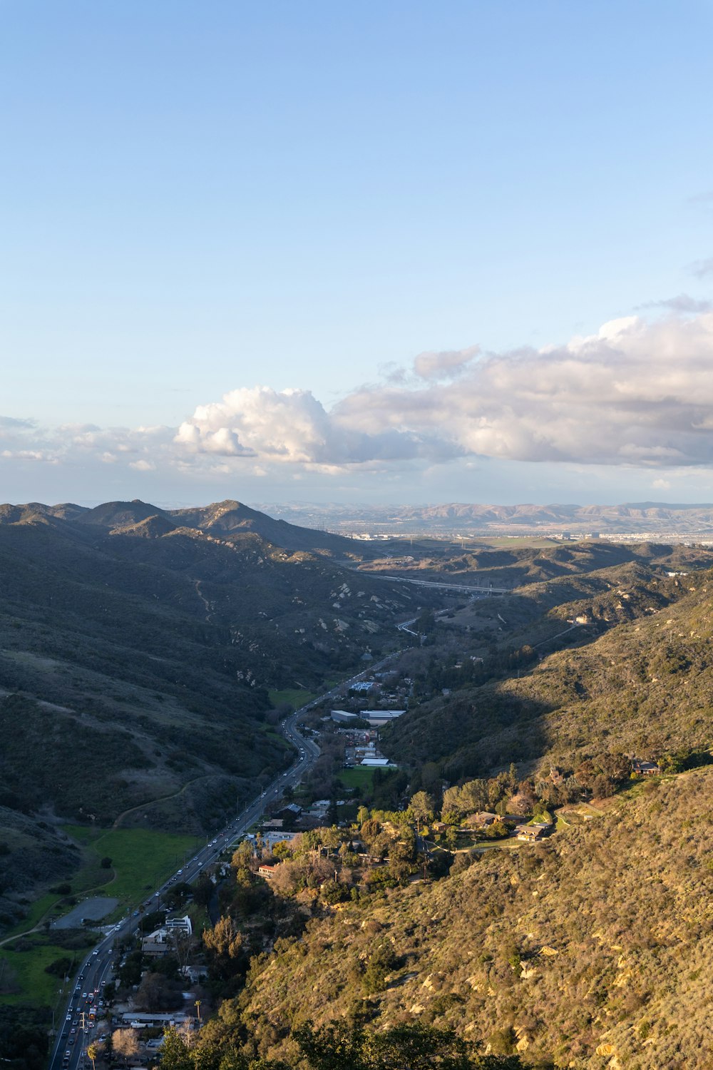 a view of a valley with a river running through it