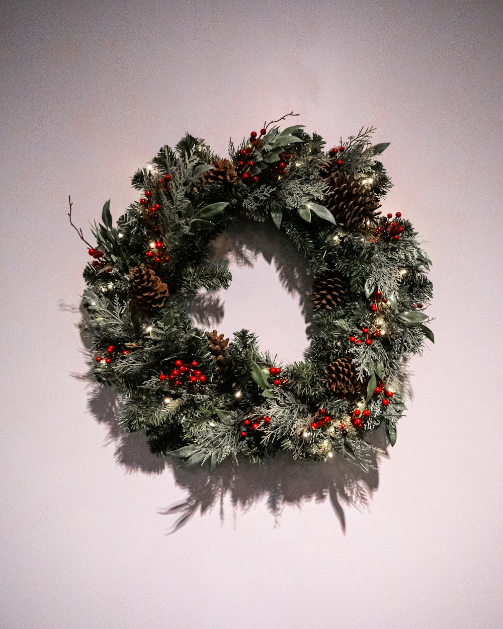 a christmas wreath is hanging on a wall