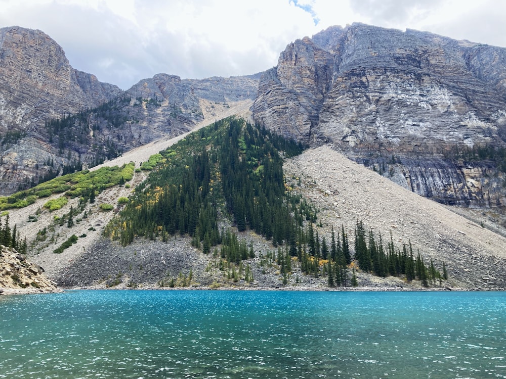 a mountain with a body of water in front of it