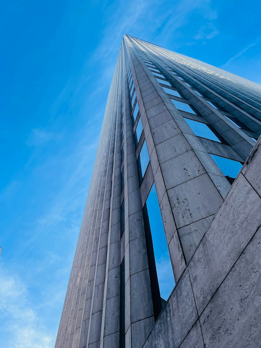 a very tall building with a sky in the background