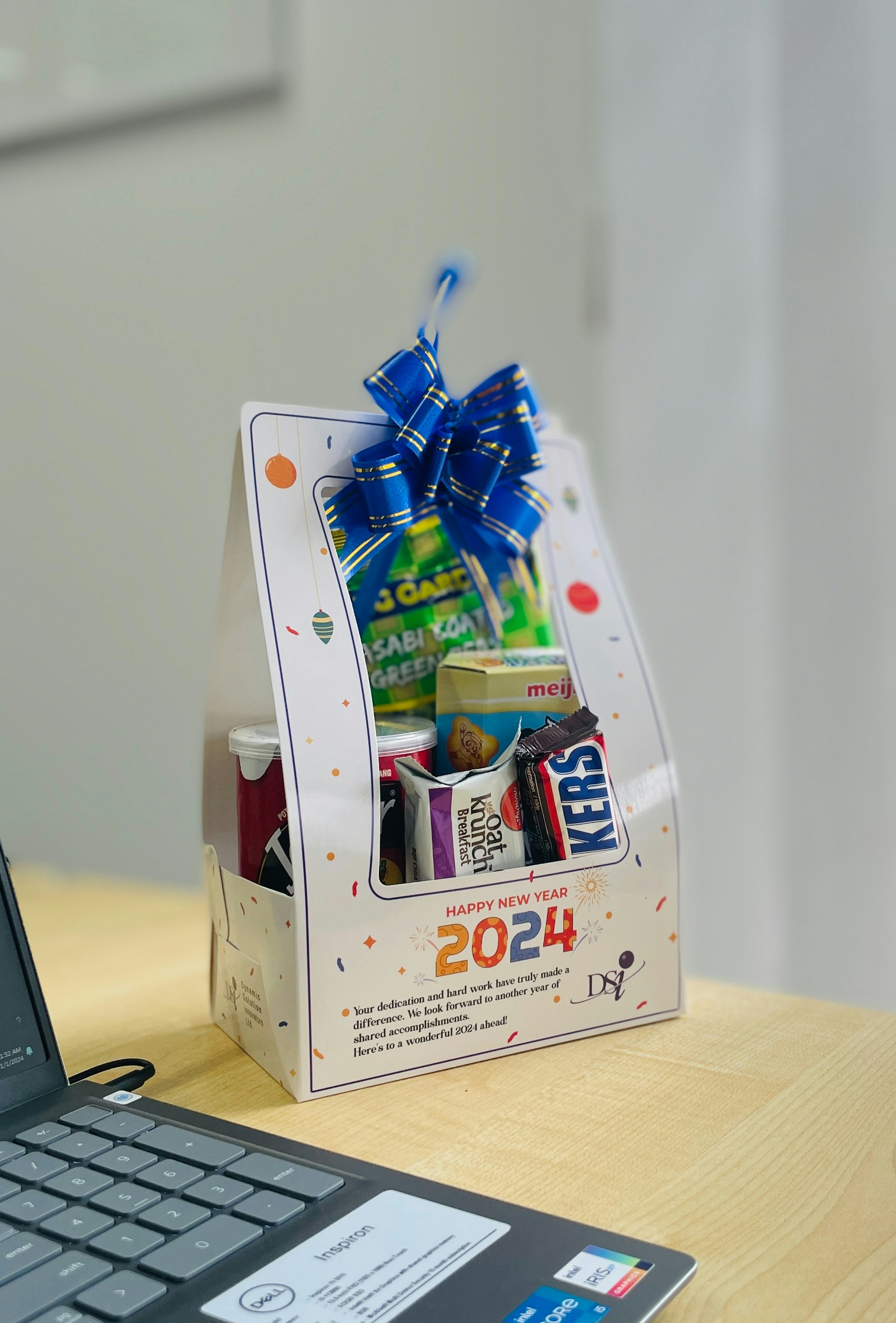 a laptop computer sitting on top of a wooden desk