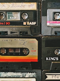 a pile of old cassettes sitting on top of each other