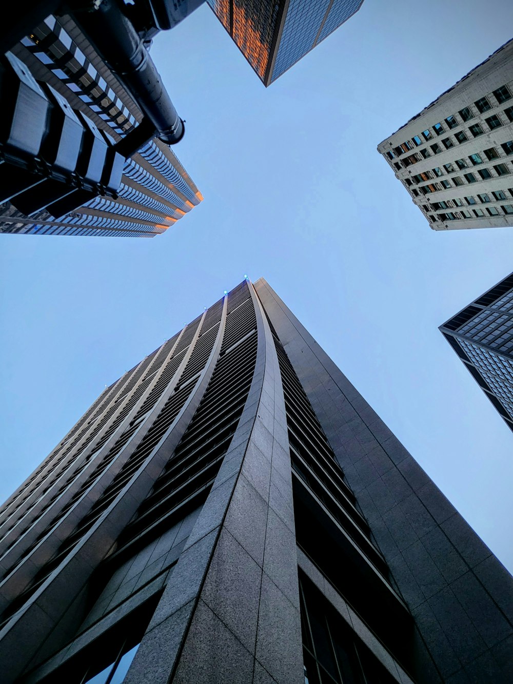 looking up at tall buildings in a city